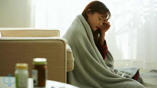 体調不良の女性